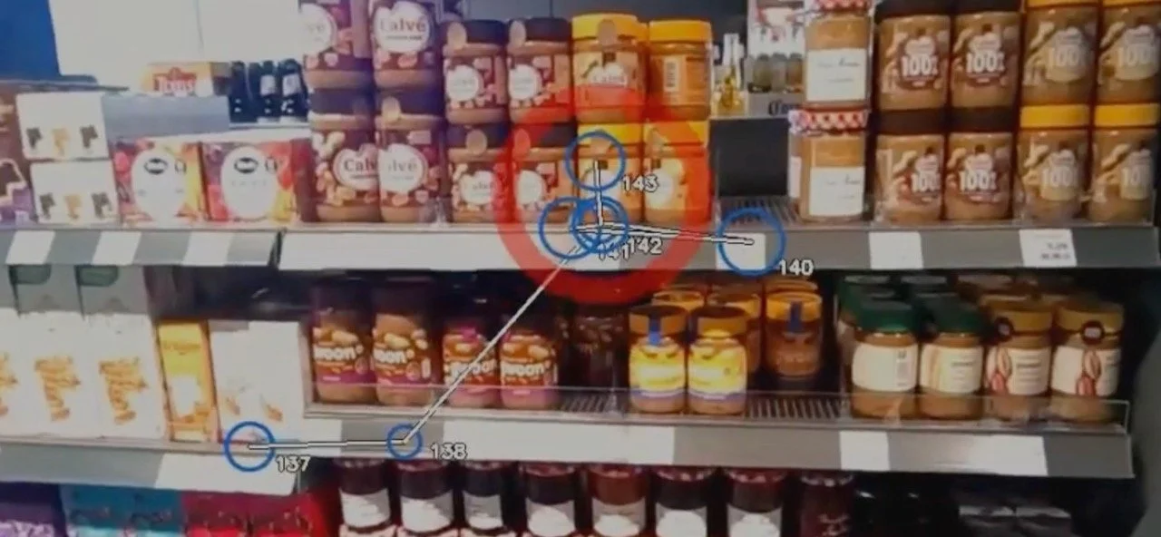 Shop shelf with peanut butter and jams with a research graphic in front