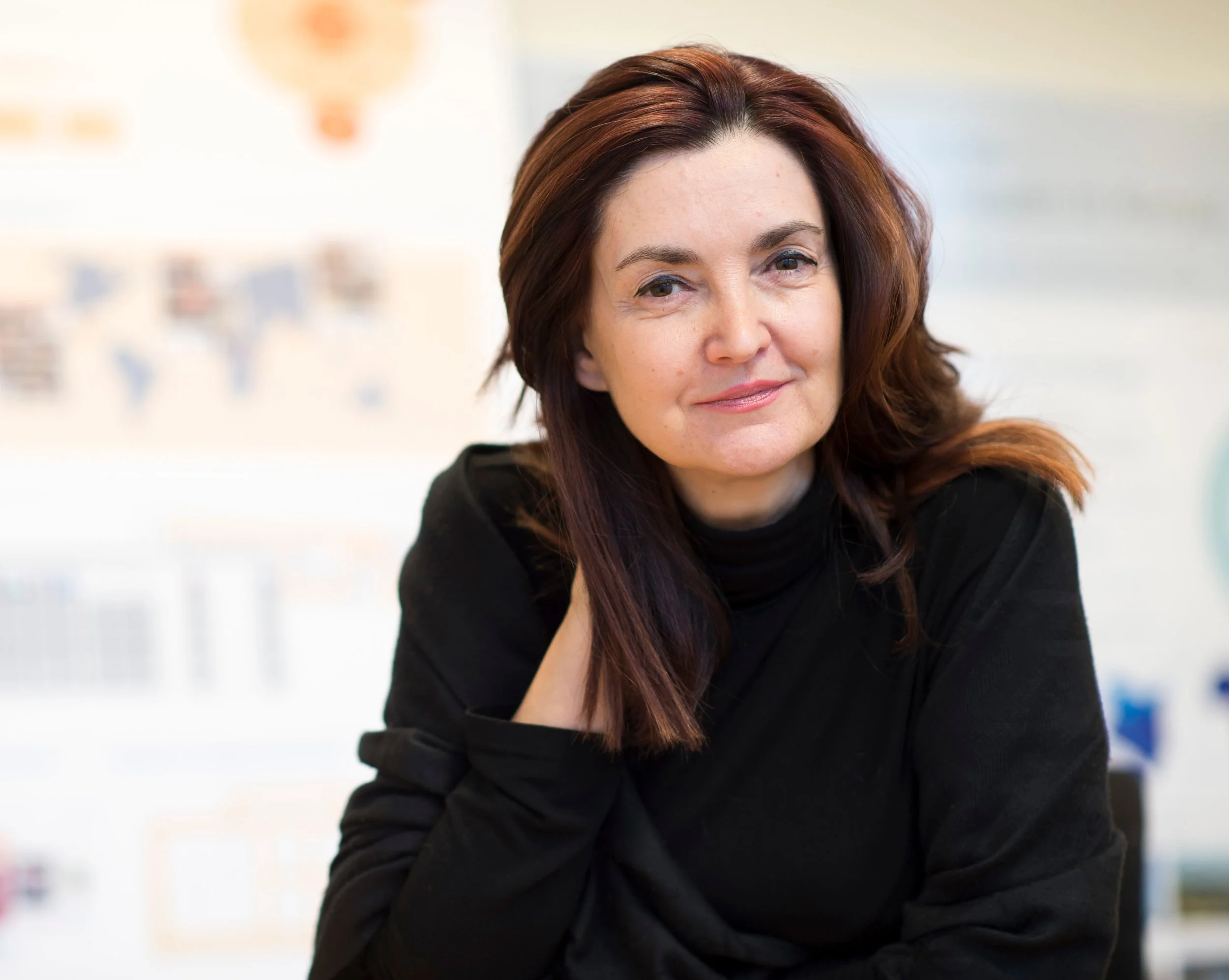 Woman with long brownish-red hair