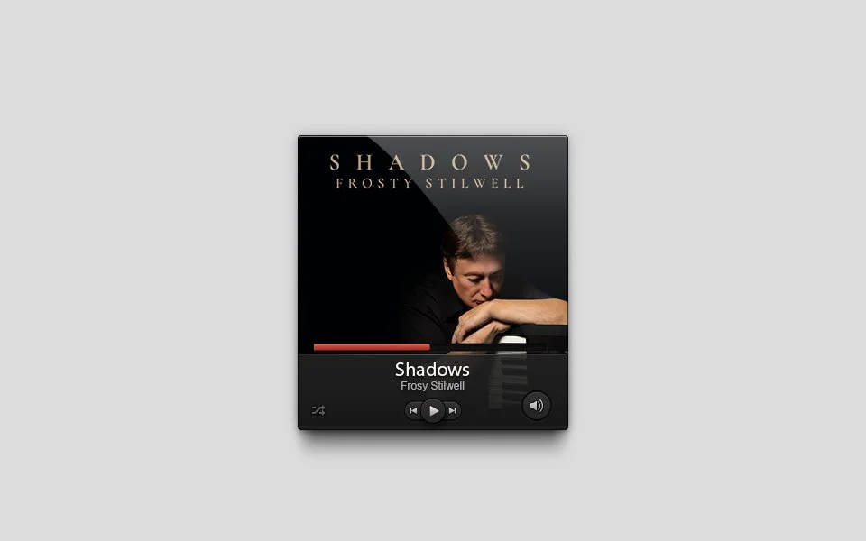 Music player screen showing album cover for Frozy Stilwell's "Shadows", with a photo of a man resting his head on his arm, set against a dark background.