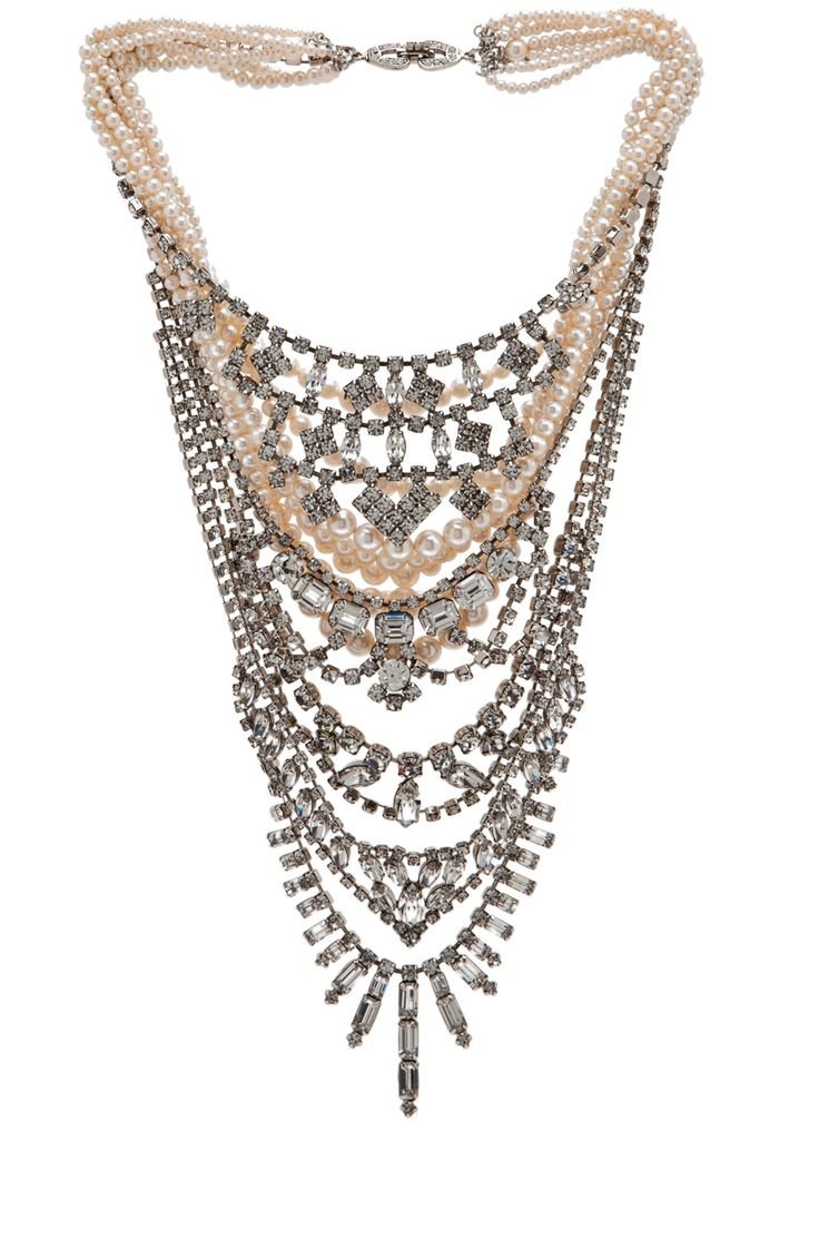 Multiple strands of pearl and diamond necklace with intricate design and silver accents.