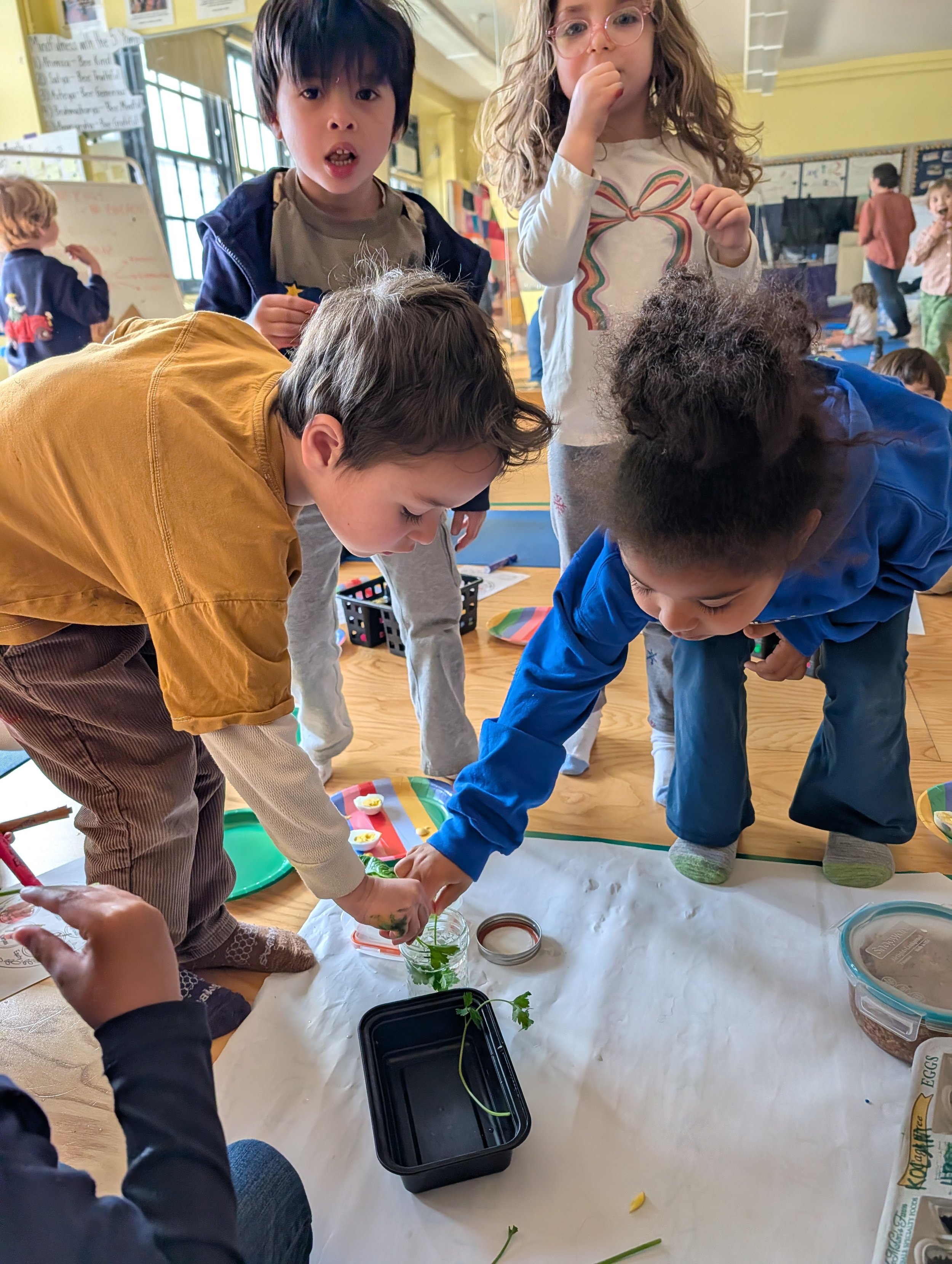 Brooklyn kids learning Jewish stories by eating the symbolic Passover foods