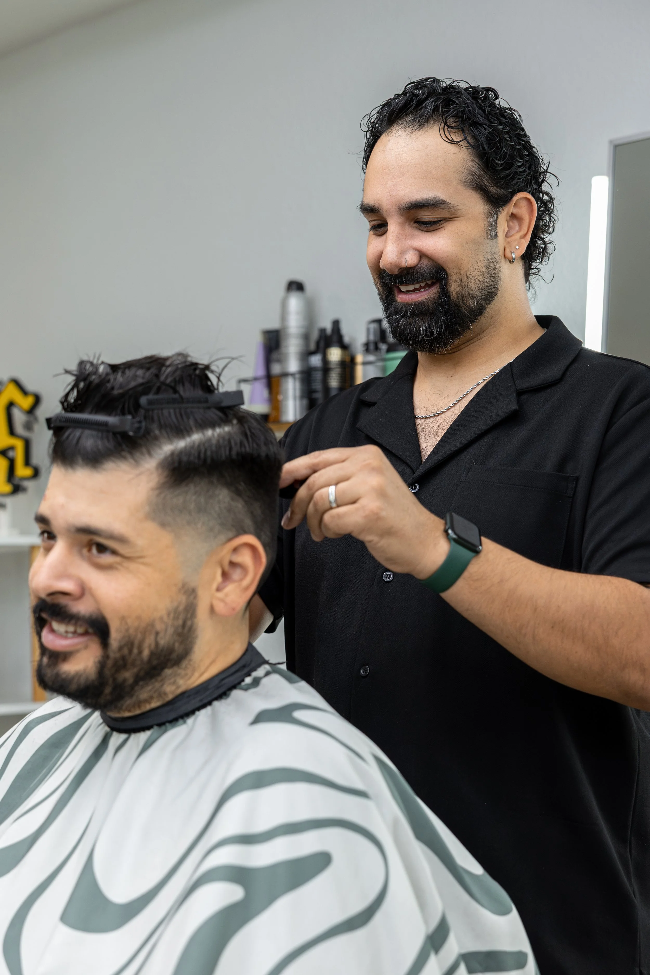 South austin Barber cutting a man's hair at common space barbershop in wastage