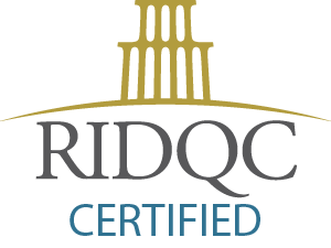 RIDOC Certified logo with a stylized representation of a building above the text.