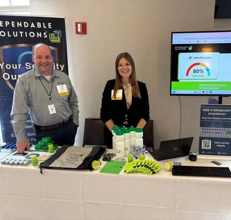 trade show photo of dependable solutions employees behind a booth