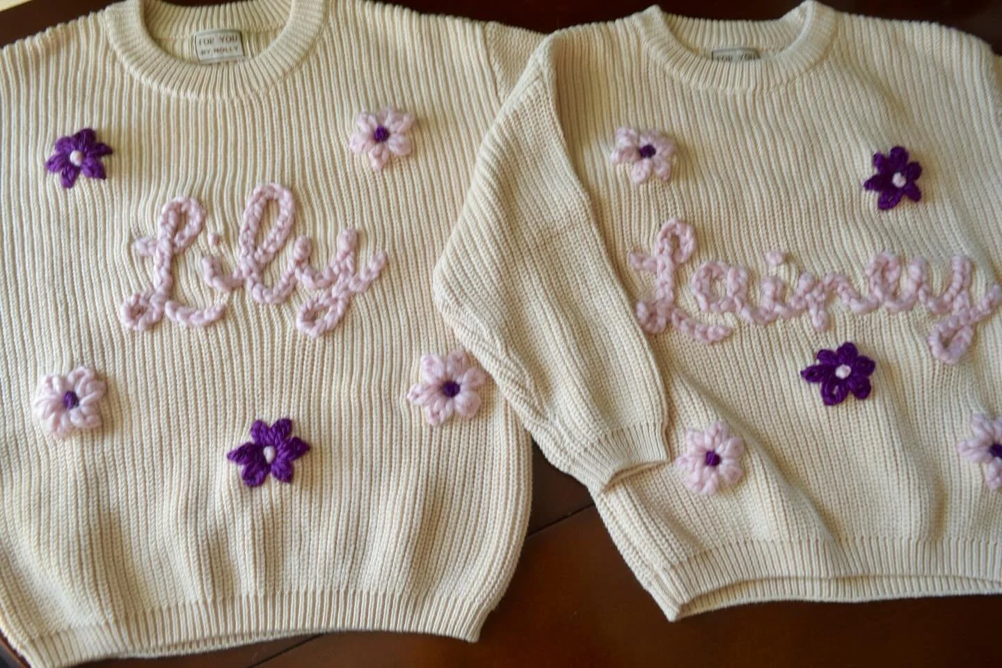 The girls 🌸 How cute are these?! So perfect for sisters, friends, cousins&hellip; anyone! Matching outfits is peak girlhood 🫶🏻

Lily and Lainey in cream with light pink writing and pink + purple flower detail 🩷