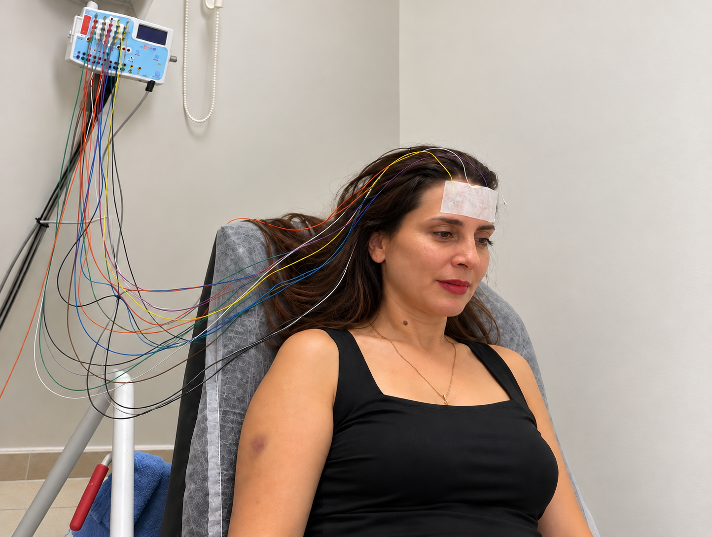 This is an image of a doctor undergoing tests while listening to a sound collage. it is for purposes of demonstration only, and is not a photo of a patient.