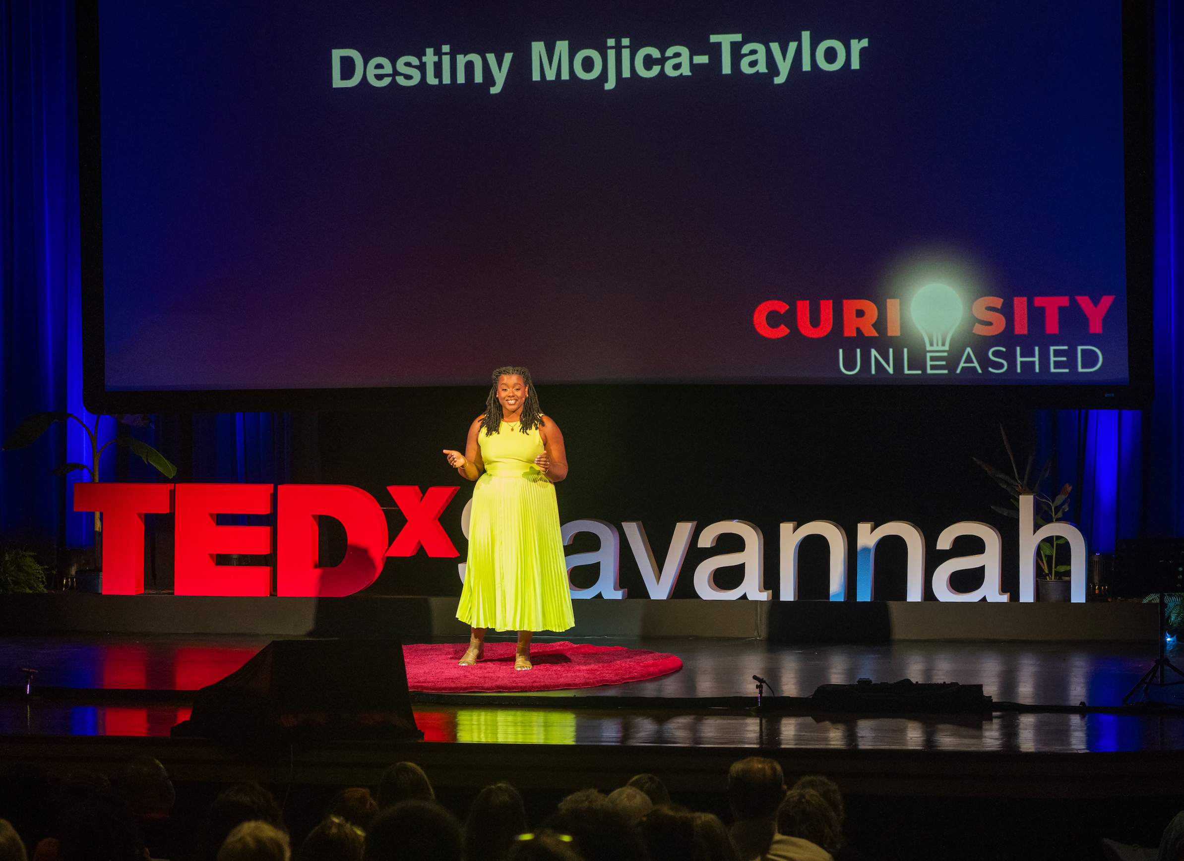Destiny Mojica-Taylor talking on the TedXSavannah stage