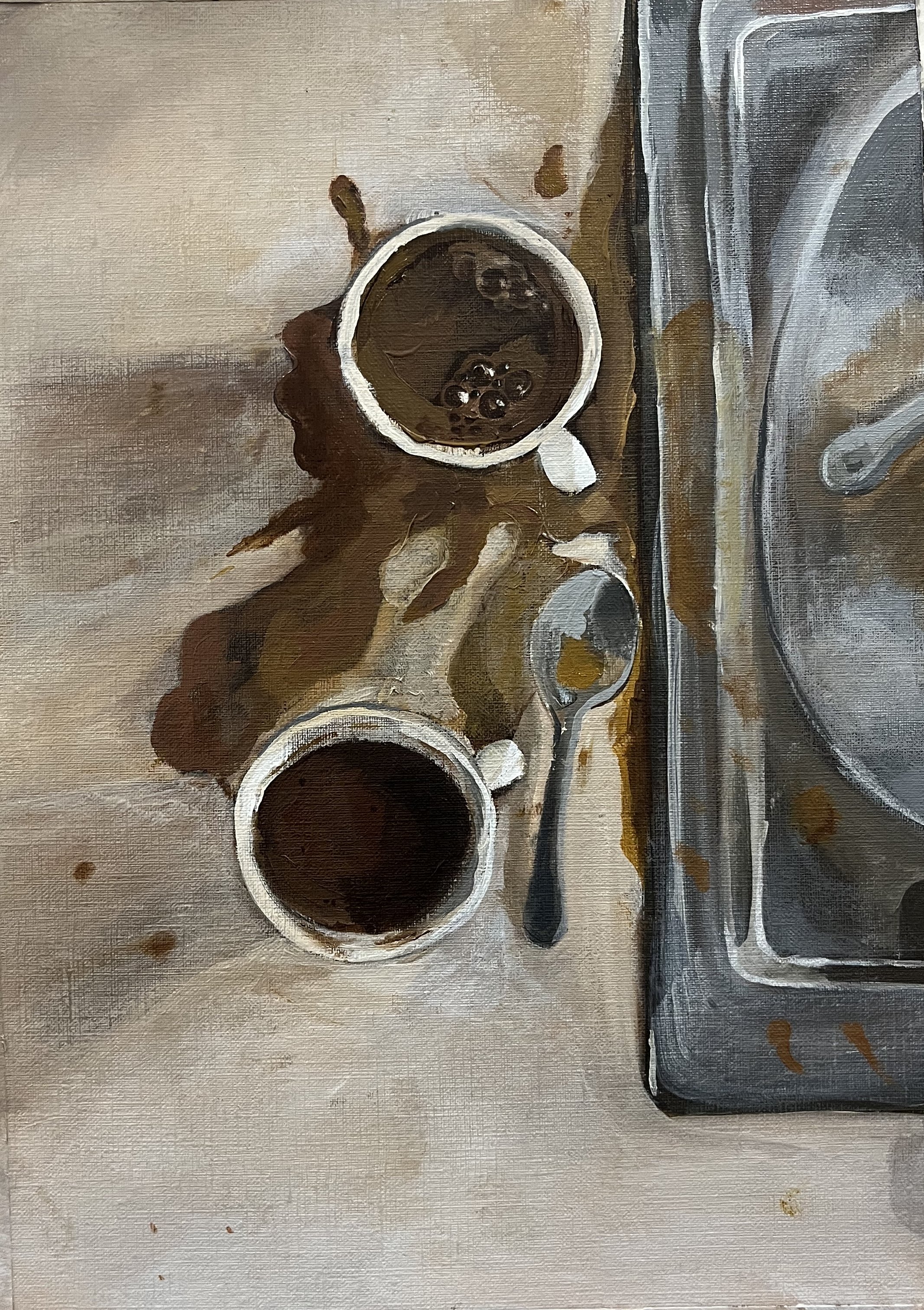 Two cups of black coffee, a spoon, and spilled coffee on a countertop near a stovetop.