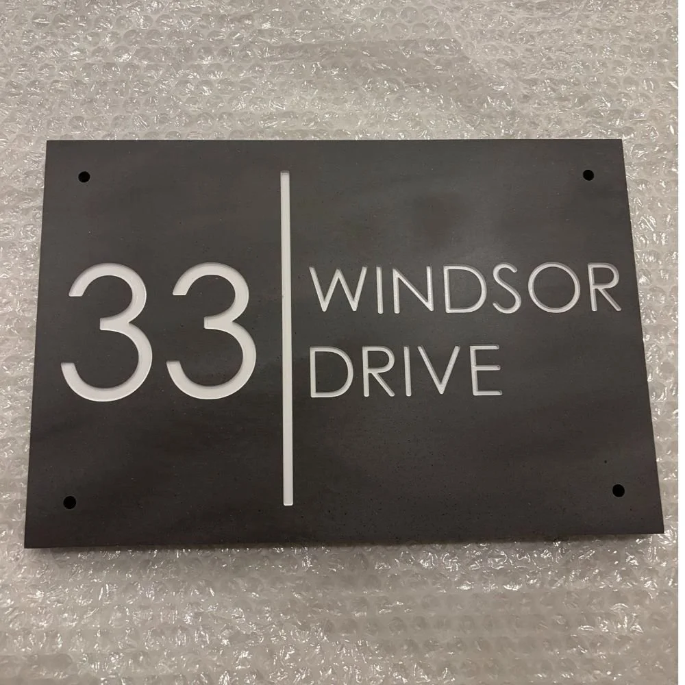 Modern Rectangle Engraved Stone House Sign with Vertical Line in Dark Slate and Pebble text.