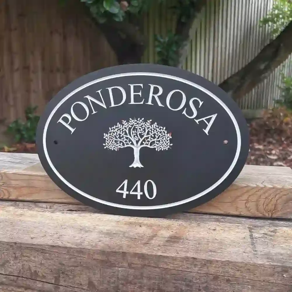 Oval Engraved Stone House Sign with Motif & border