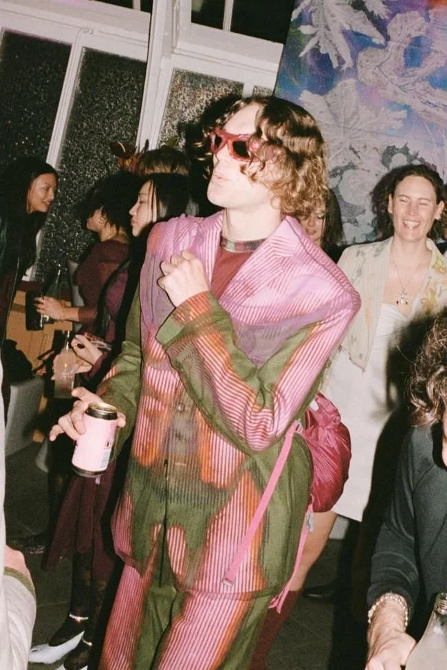 The groom’s mother designed the bride’s dress at this psychedelic purple wedding filled with fungi and florals.jpeg