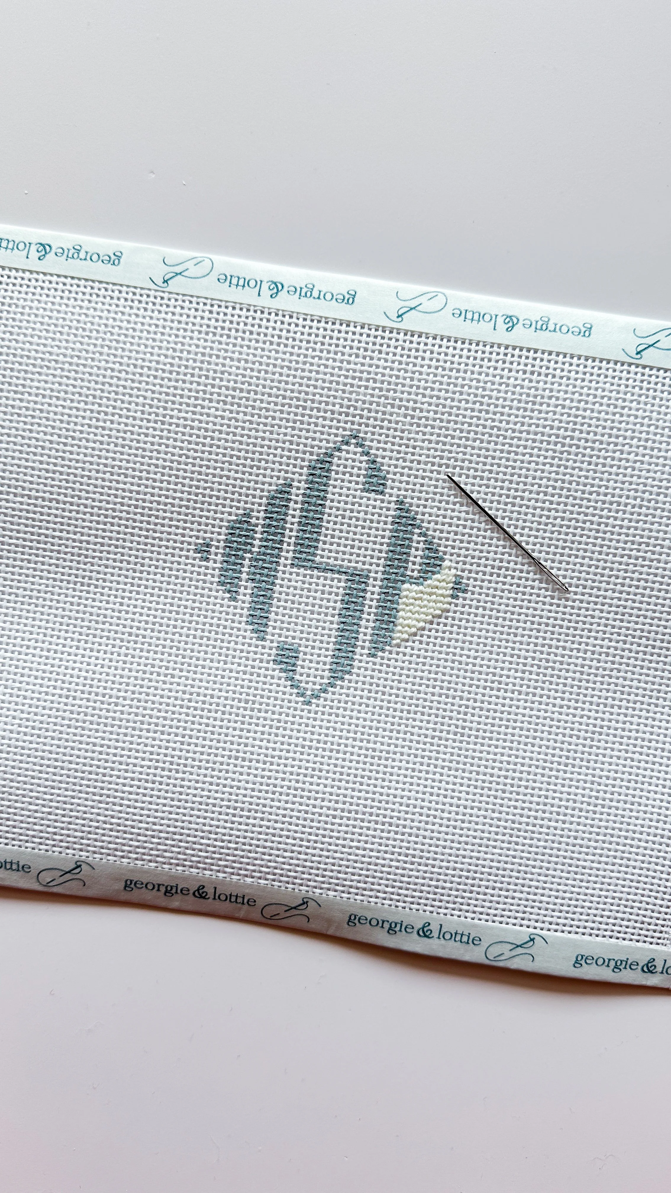 needlepoint monogram blue and white