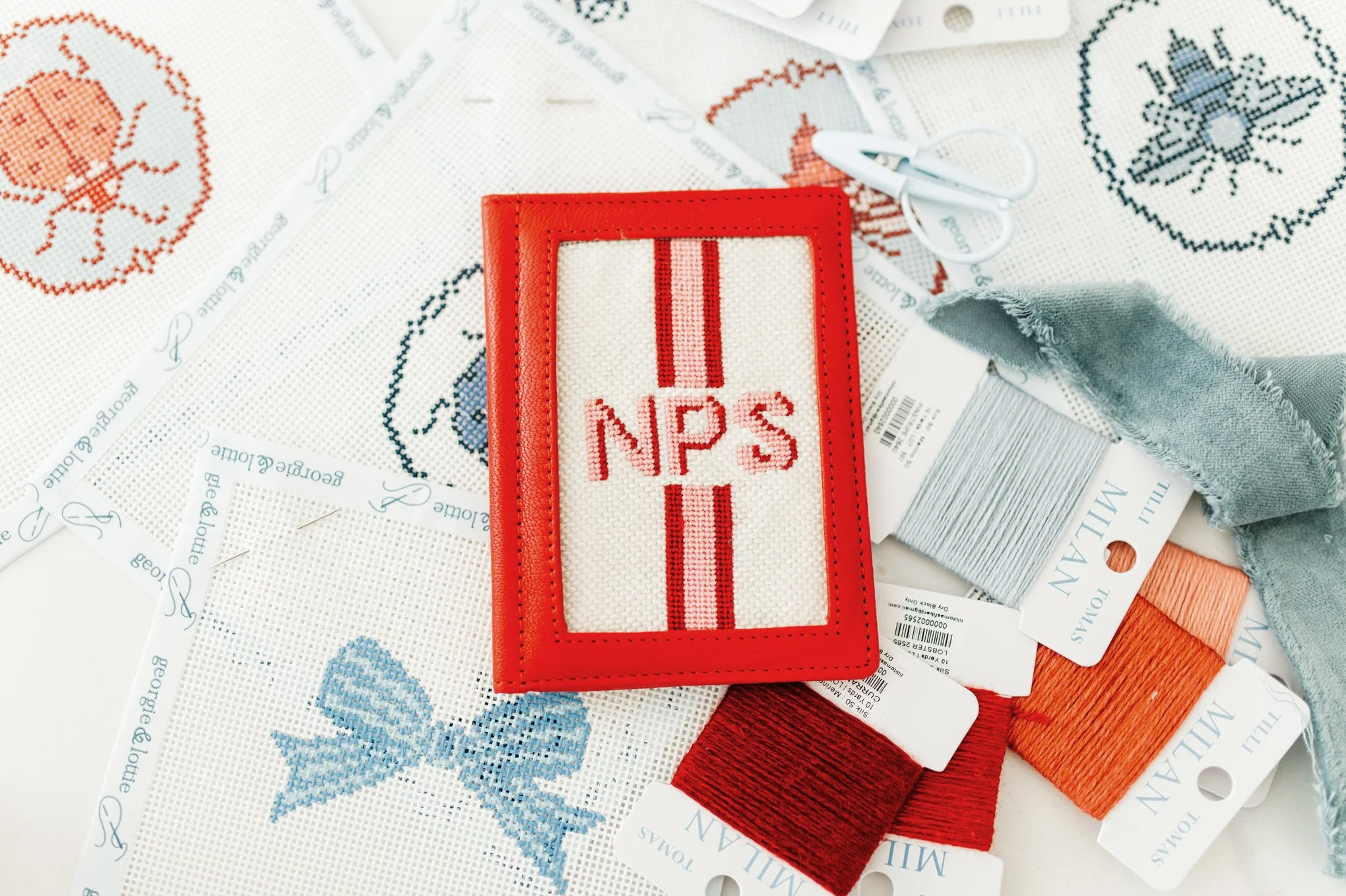 a read needlepoint passport holder on needlepoint canvases