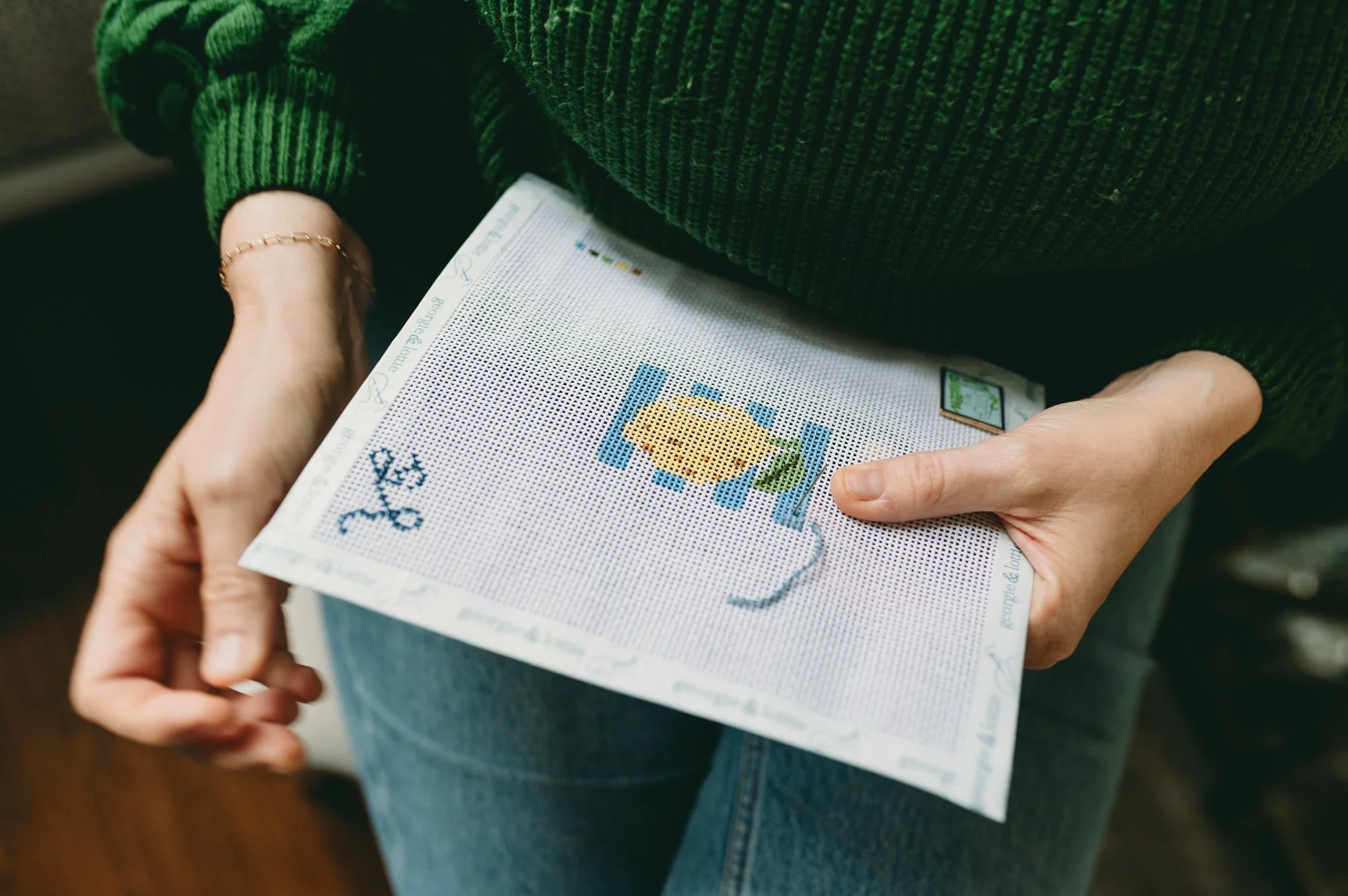 Stitching a lemon hand painted needlepoint canvas by Georgie & Lottie Co