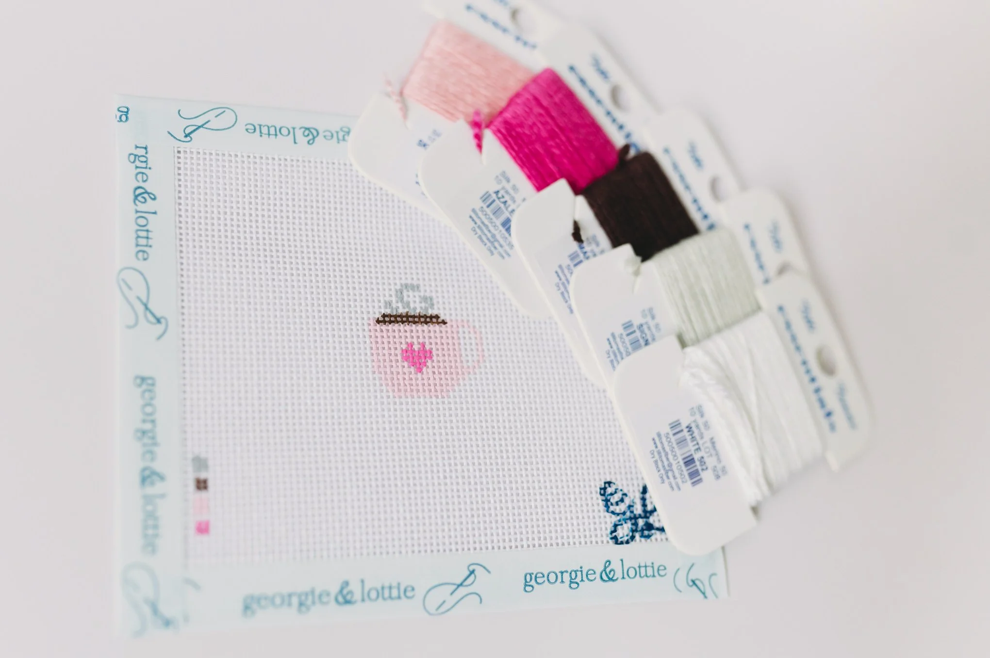 Beginner needlepoint bag tag canvas with Tilli Tomas Essentials threads.