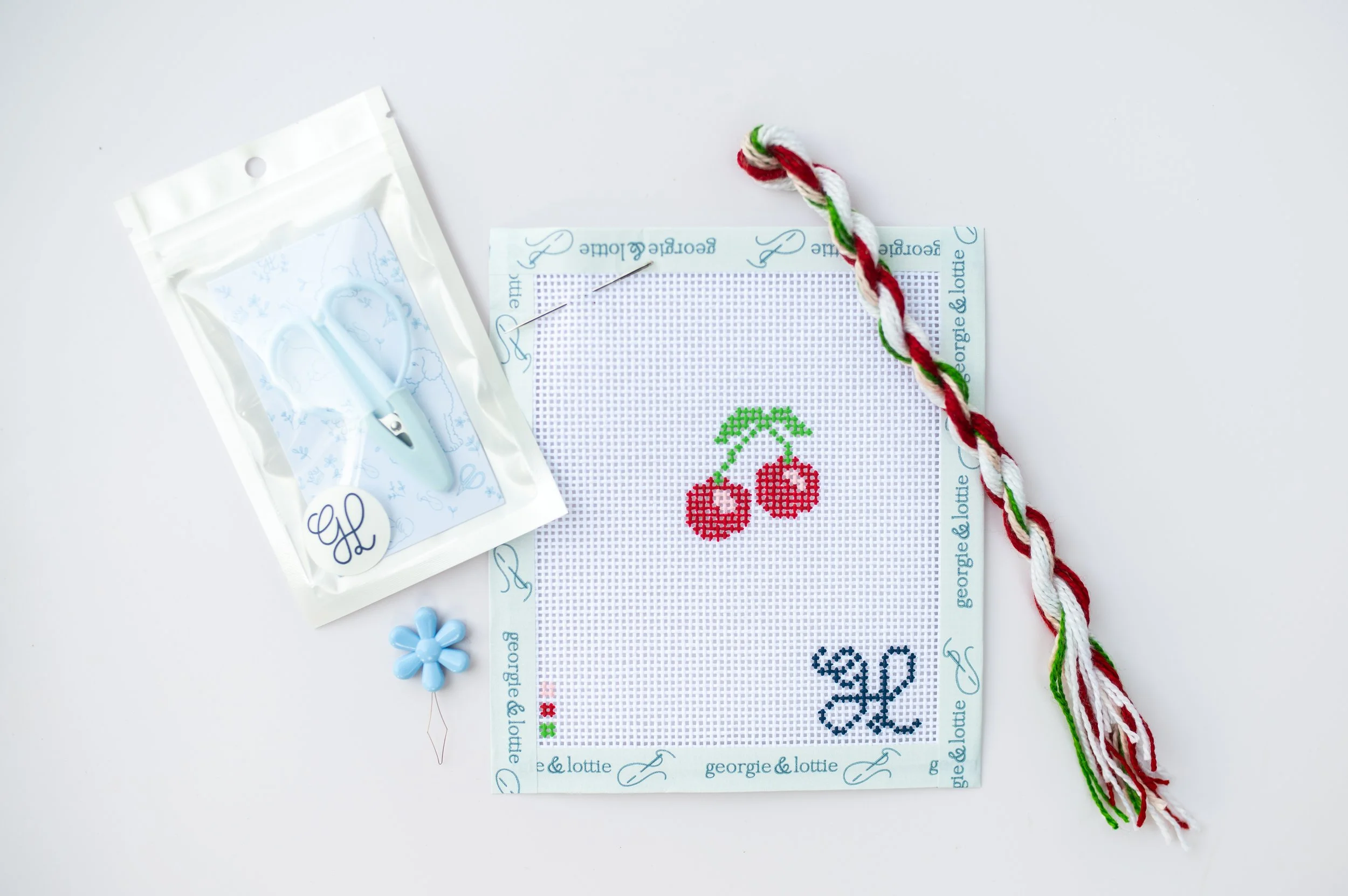 Beginner needlepoint canvas from Georgie & Lottie Co., hand-painted design on 13-mesh
