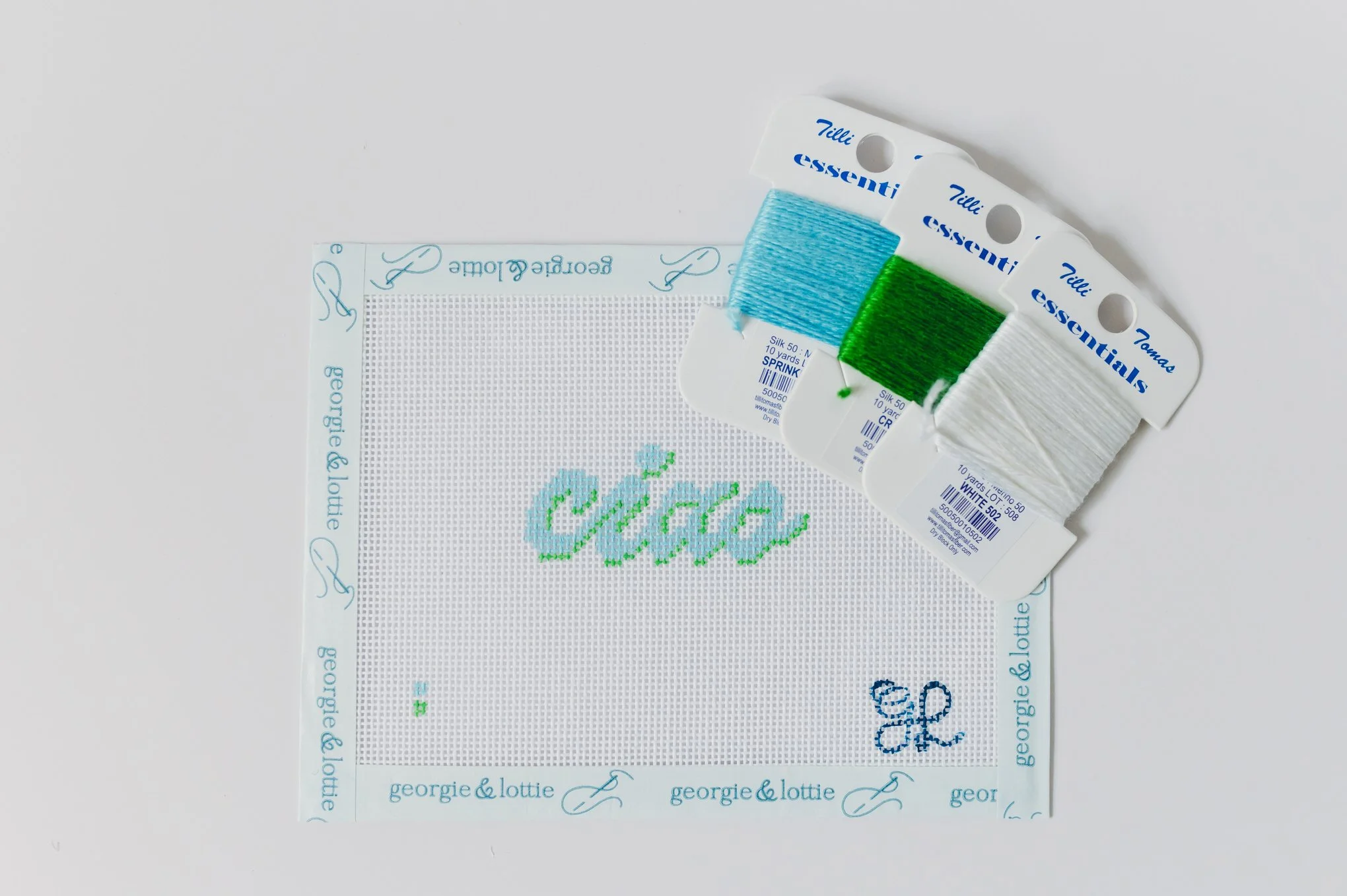 Georgie & Lottie ‘Ciao’ needlepoint kit in blue and green with hand-painted canvas and coordinating threads.