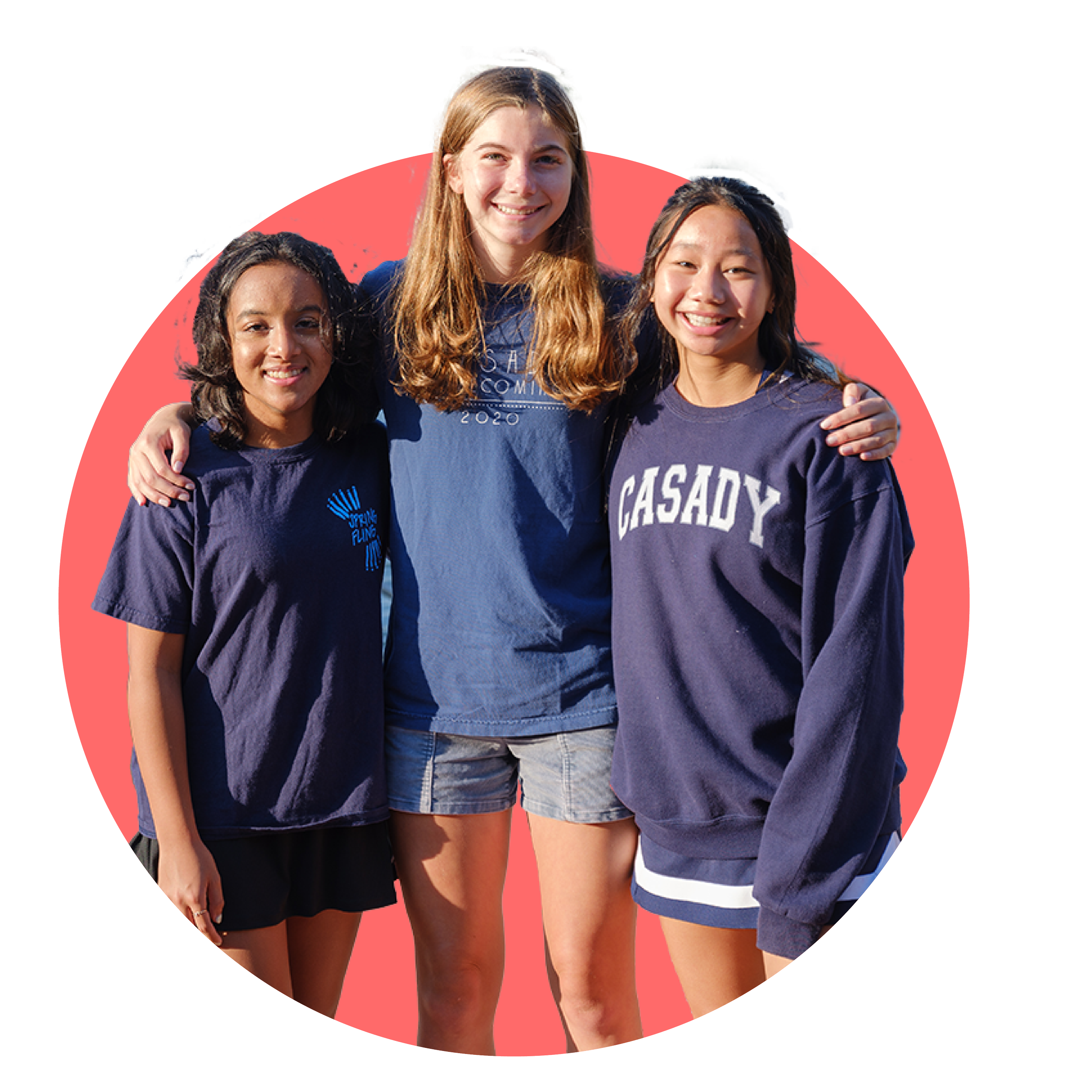 Three young women standing together outdoors with their arms around each other, smiling at the camera, against a pink background.