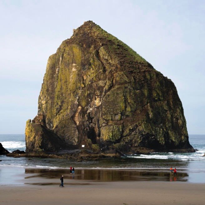 Haystack Rock, Cannon Beach. A great day 1 stop on an Oregon Coast road trip&mdash;walkable, scenic, and an easy place to ease into the drive.

#WildHerTravel #OregonRoadTrip #CannonBeach