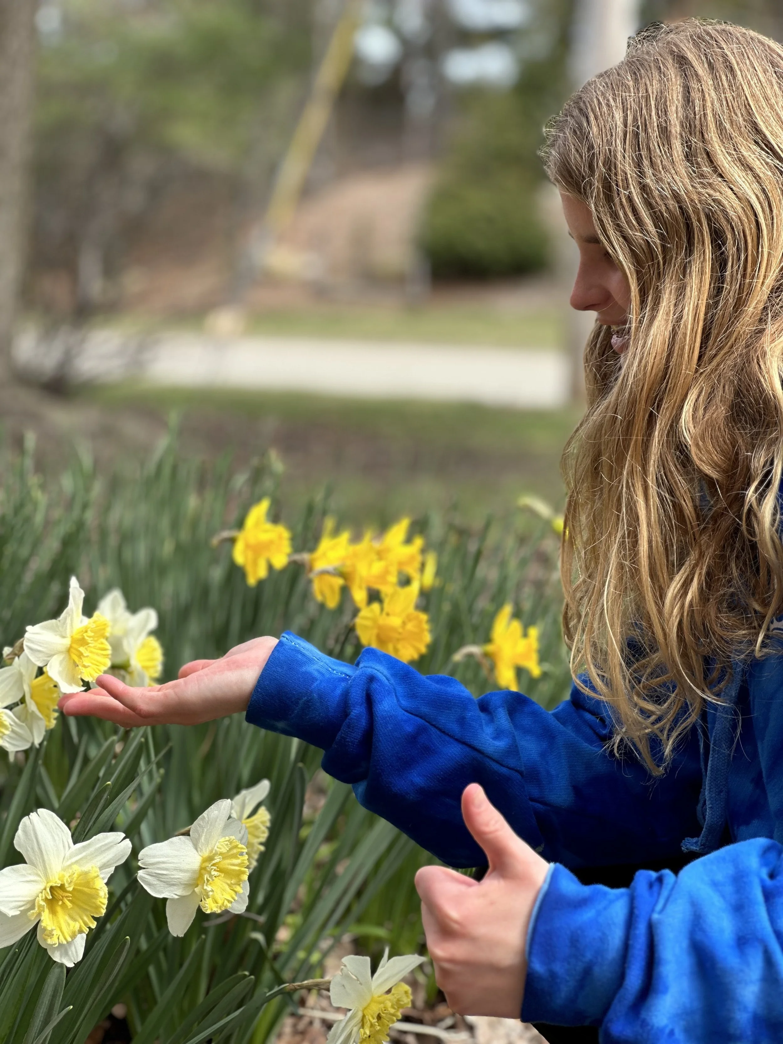 Girl holding a daffodil
