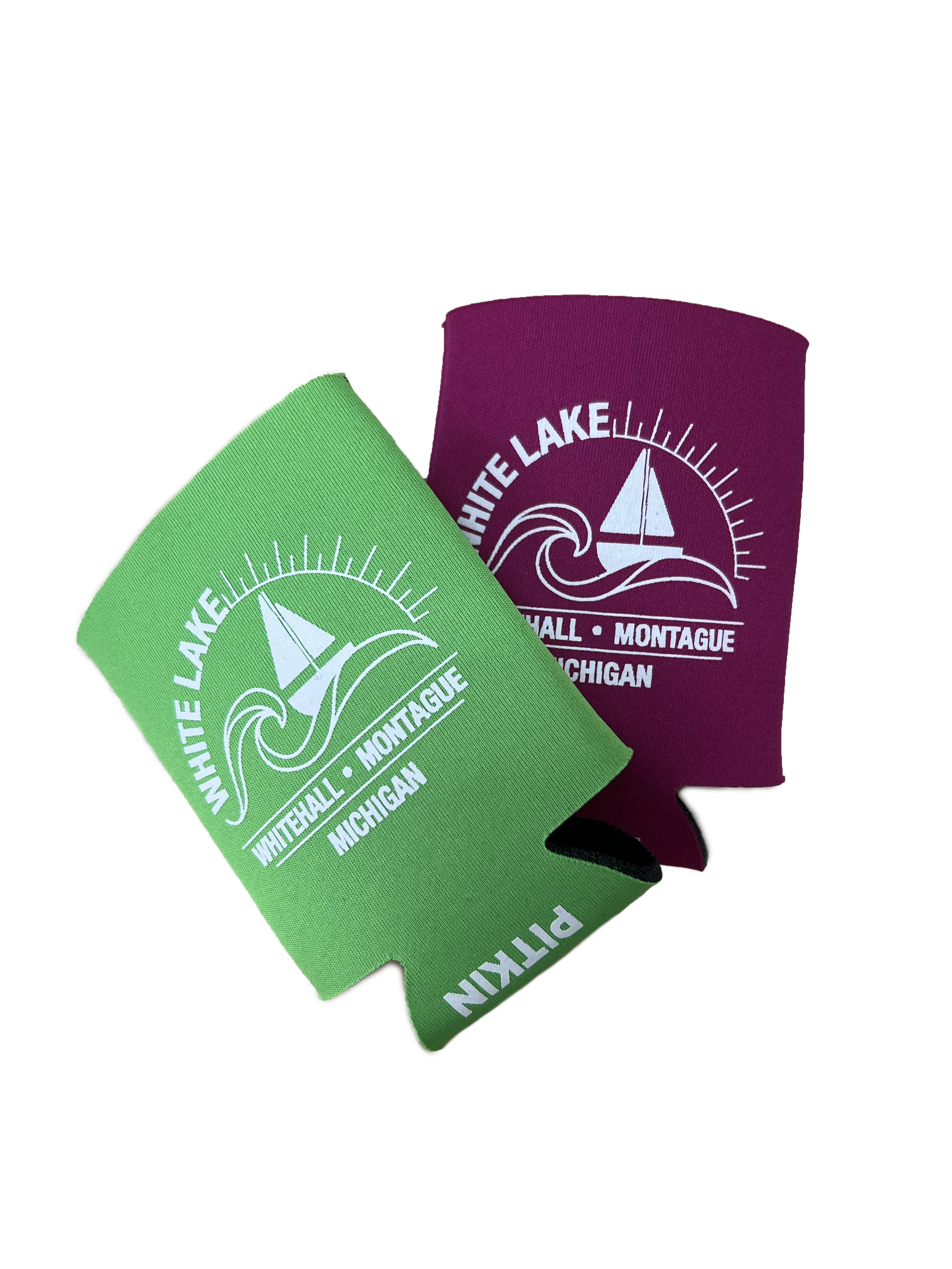 Two colored eye black stickers, one green and one maroon, with white text and a sailboat logo, representing White Lake in Michigan.
