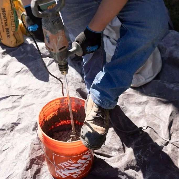 A St. Paul, MN homeowner inspects a brick chimney with a professional, evaluating whether repair or rebuild is needed.