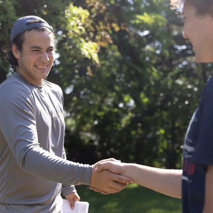 Contractor inspecting an aging St. Paul masonry chimney, assessing cracks, spalling bricks, and structural integrity before rebuild.