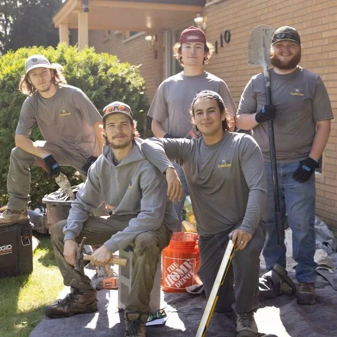 Skilled mason rebuilding a chimney on a Tampa home, ensuring structural integrity and compliance with local building codes.