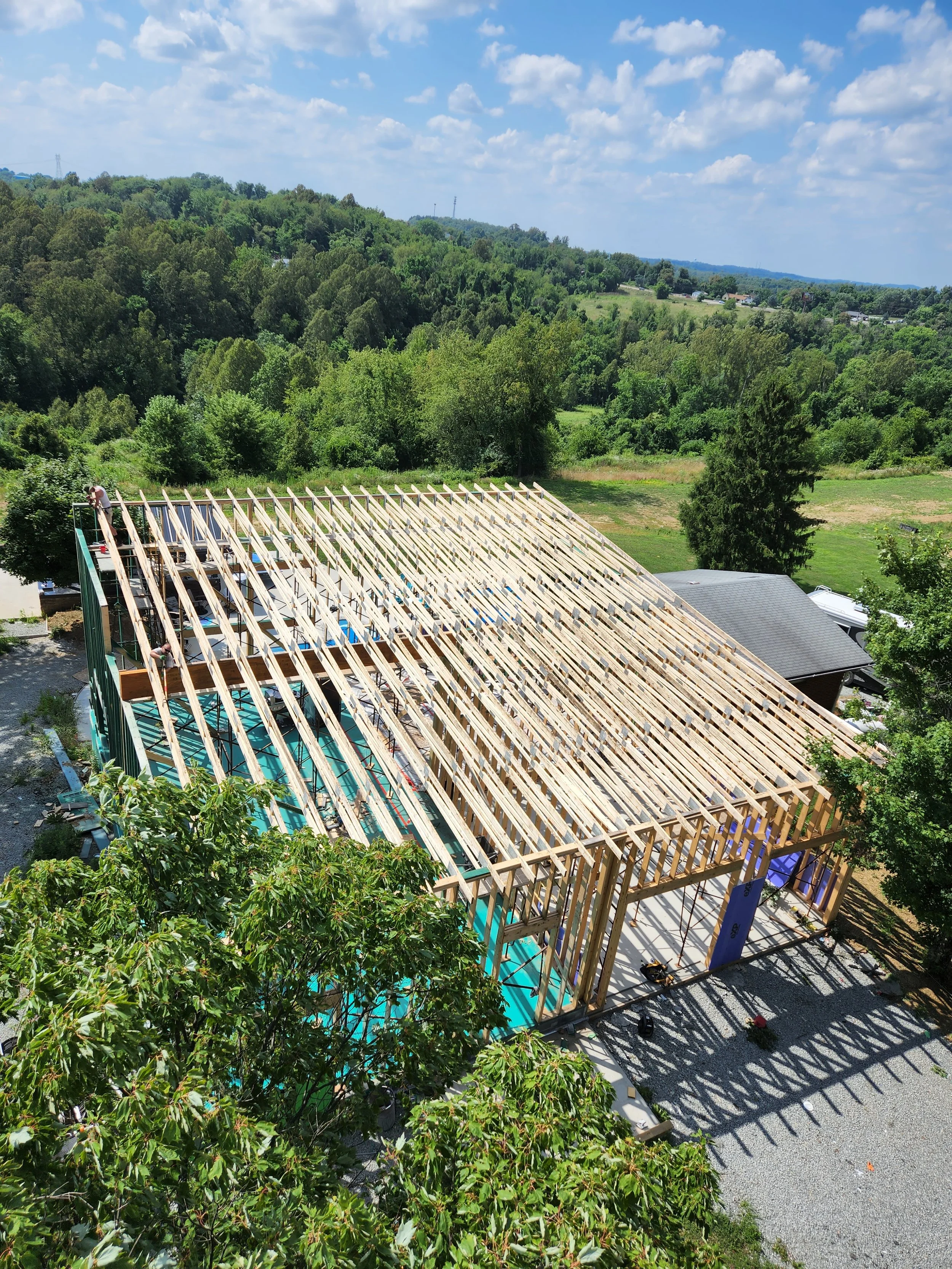 R.P.W. Contracting crew installing 60-foot commercial roof trusses on new construction framing project in Jeannette PA