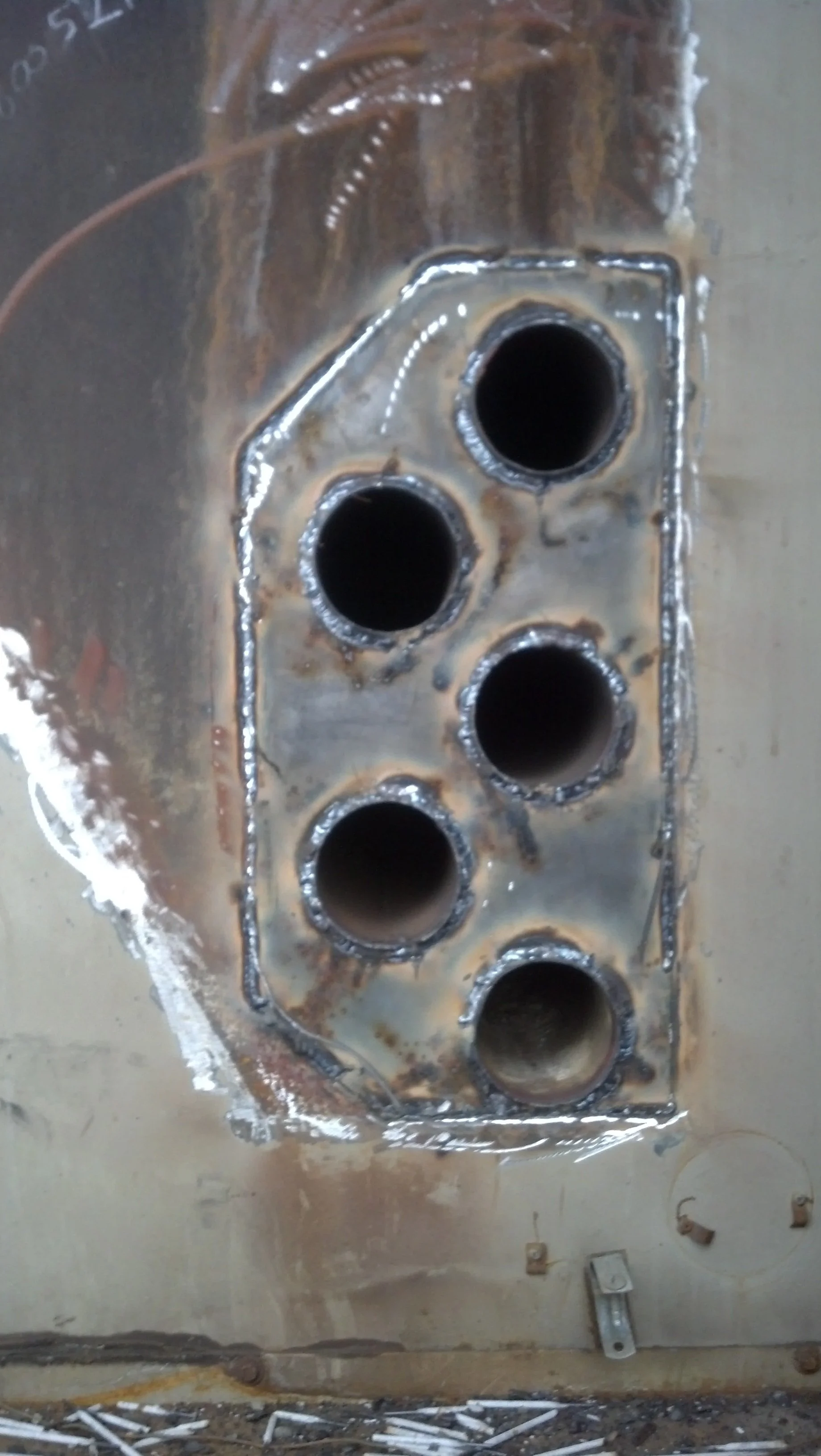 Welded furnace tube plate repair on industrial heavy equipment performed by RPW Contracting in Jeannette, PA