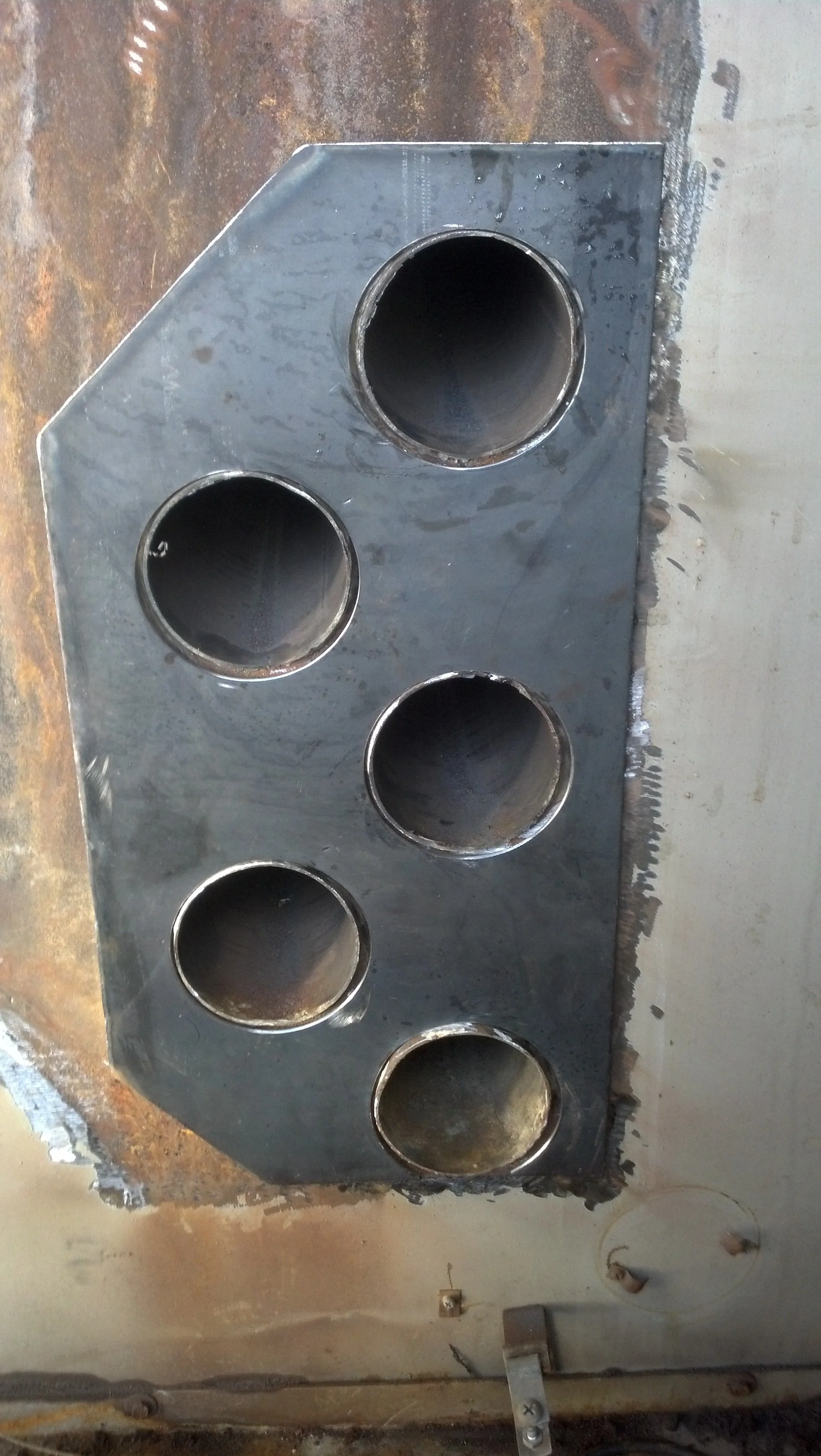 Welded furnace tube repair on heavy equipment metal plate – multi-pipe section during industrial service by R.P.W. Contracting in Jeannette, PA