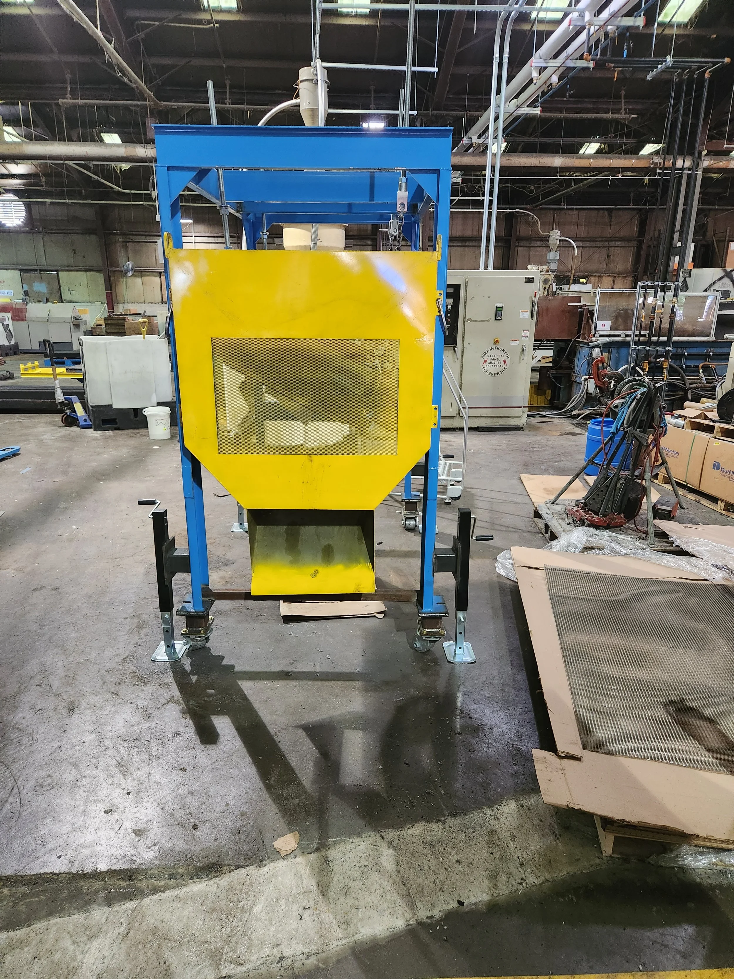 Custom-built industrial fabrication machine with powder-coated frame and integrated safety guard, designed and assembled by RPW Contracting in Jeannette, PA for specialized manufacturing applications