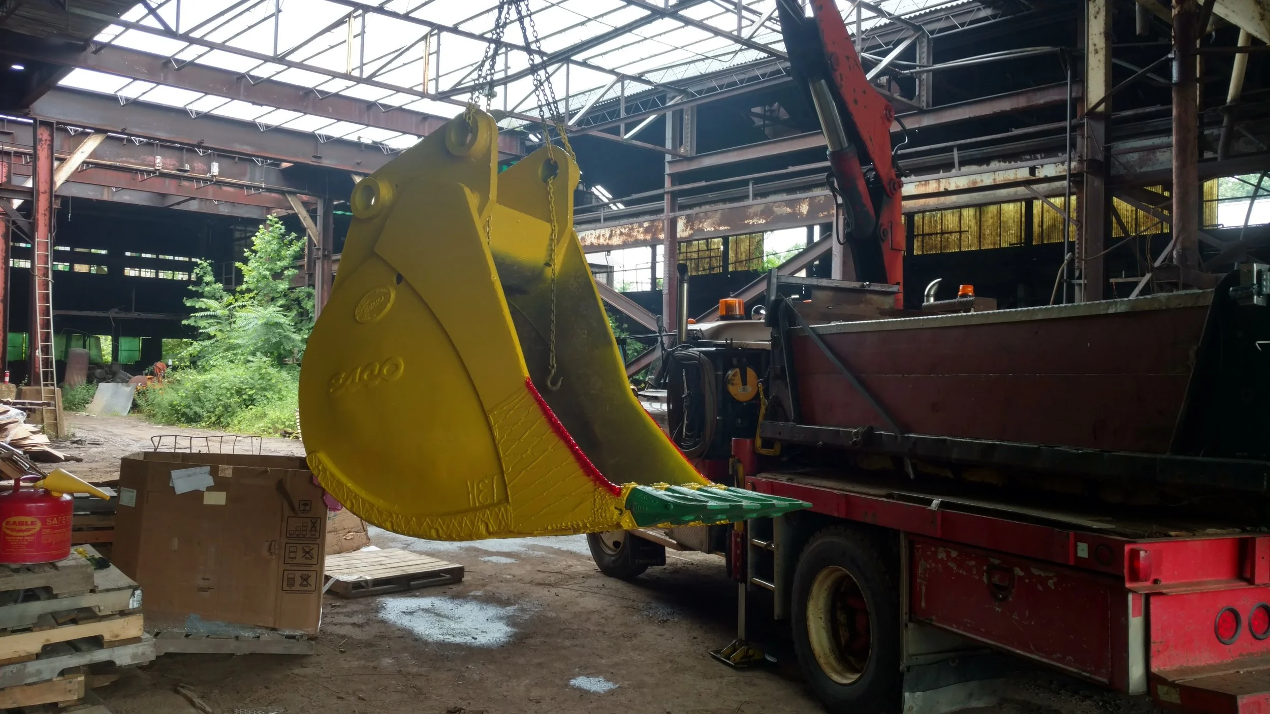 RPW Contracting lifting and delivering freshly repaired heavy equipment bucket in Jeannette, PA – mobile welding and equipment repair with on-site pickup and delivery