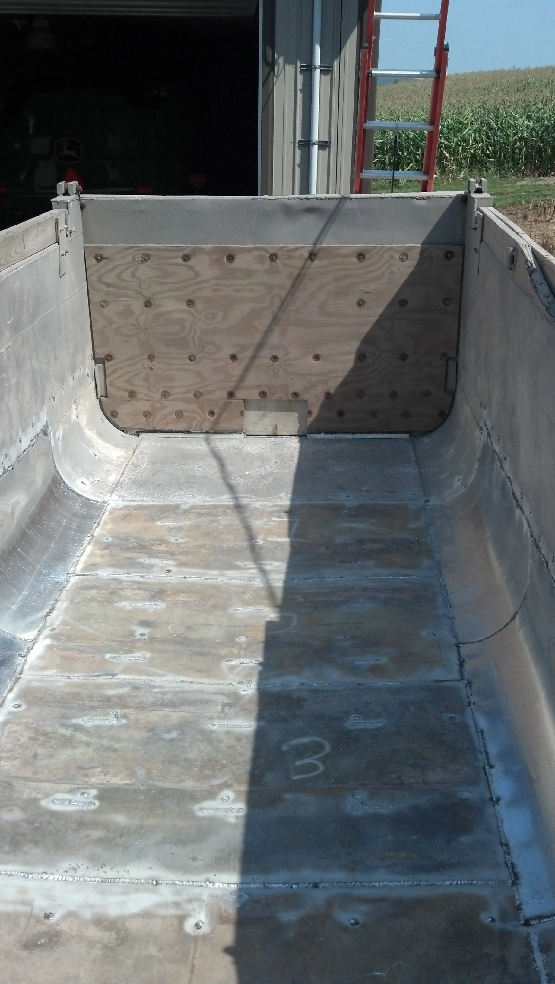 Completed aluminum truck bed repair by RPW Contracting in Jeannette, PA — reinforced trailer floor welding and custom metal restoration