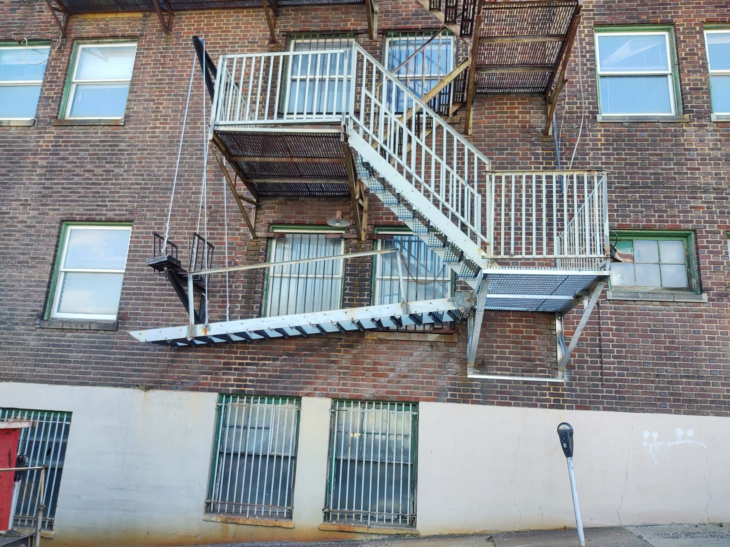 Repaired fire escape in Jeannette, PA featuring new safety cables and counterweight adjustment by RPW Contracting