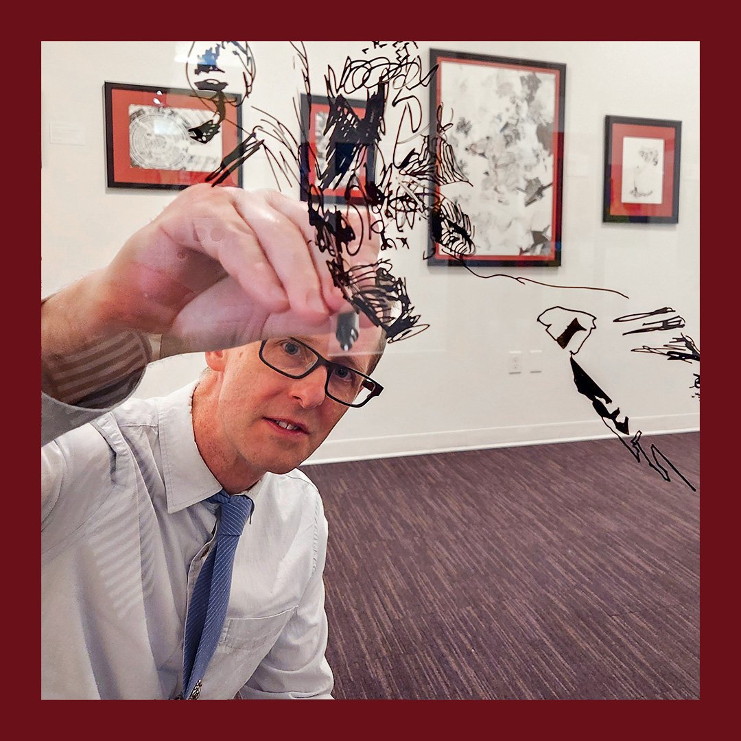 Throughout the exhibition, the artist produced a large drawing on glass