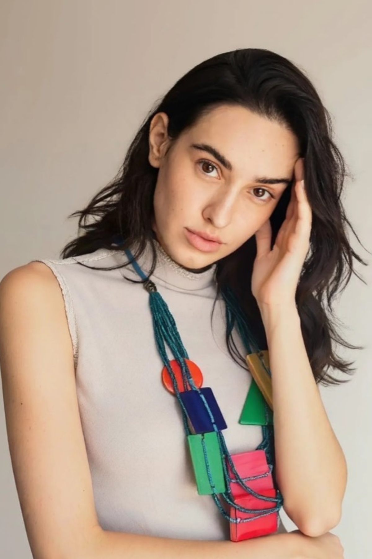 Turn heads when you enter the room wearing this statement necklace featuring multi-colored geometric wood pieces… by Sylca Designs. 