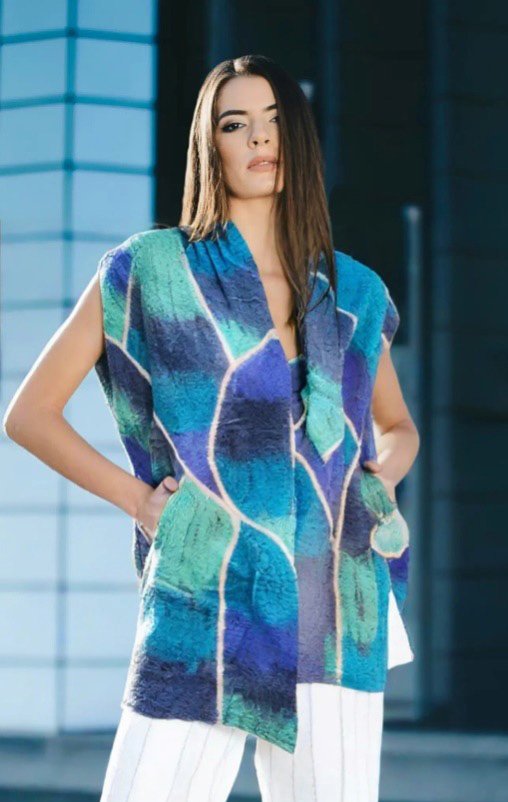 Make a blue and green entrance in this distinctive felt wrap by KooLoo.