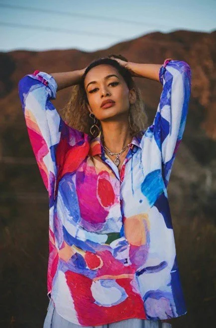 Cool and comfortable in this long colorful shirt featuring the abstract art of Claire Desjardins