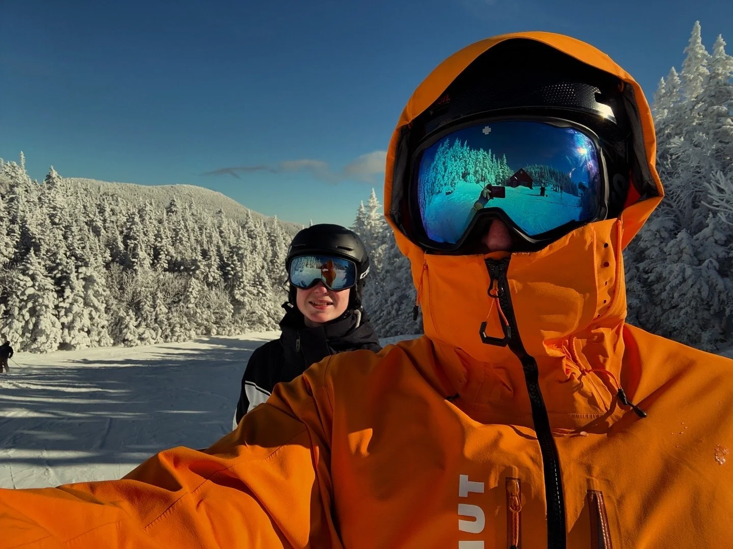 A photo of my son and I at the top of Spruce Peak in Stowe, Vermont.