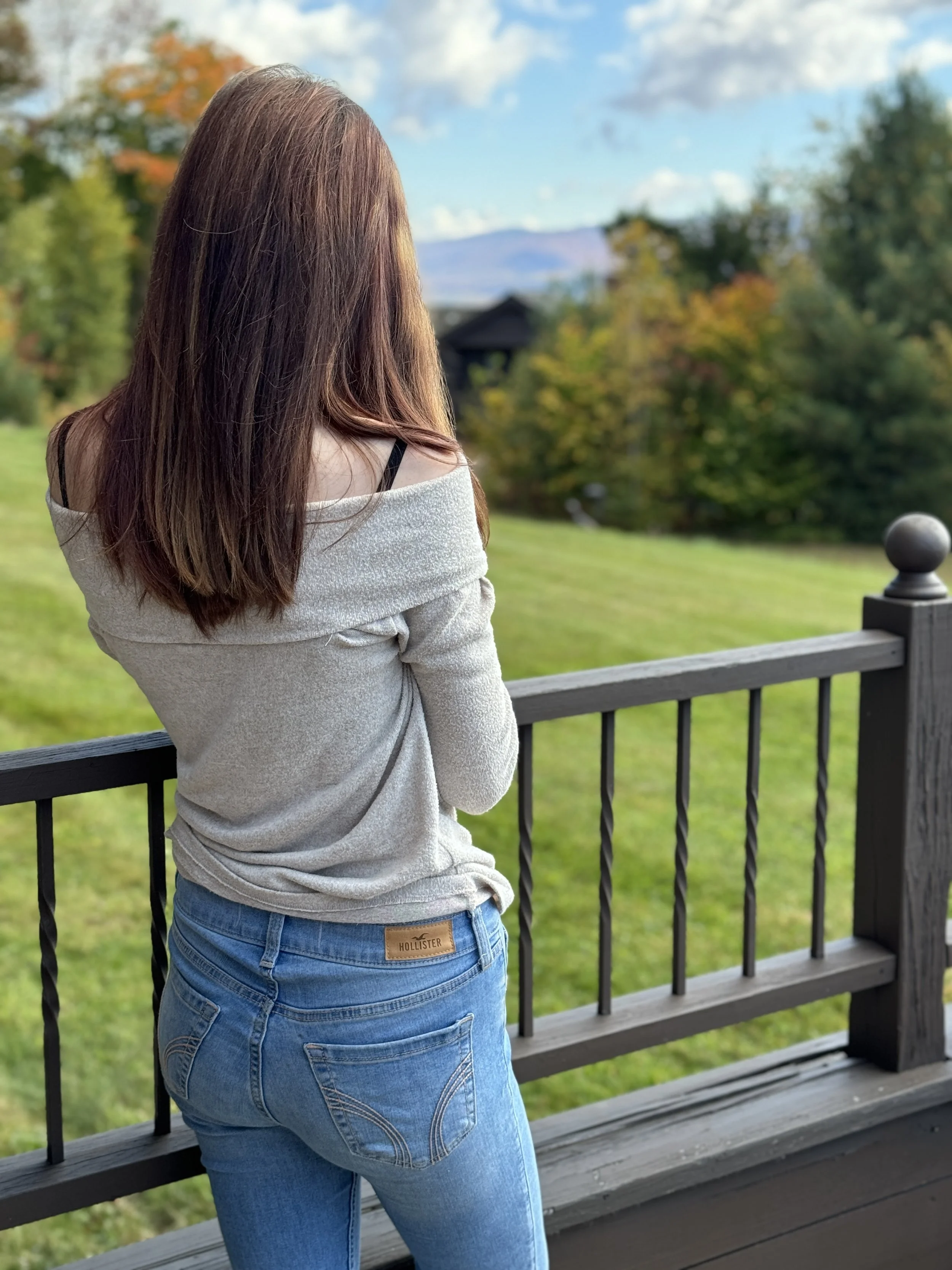 A photo of my daughter enjoying the view in Stowe, Vermont at the Trapp Family Lodge.