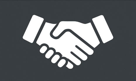Icon of two hands shaking, representing handshake or agreement.