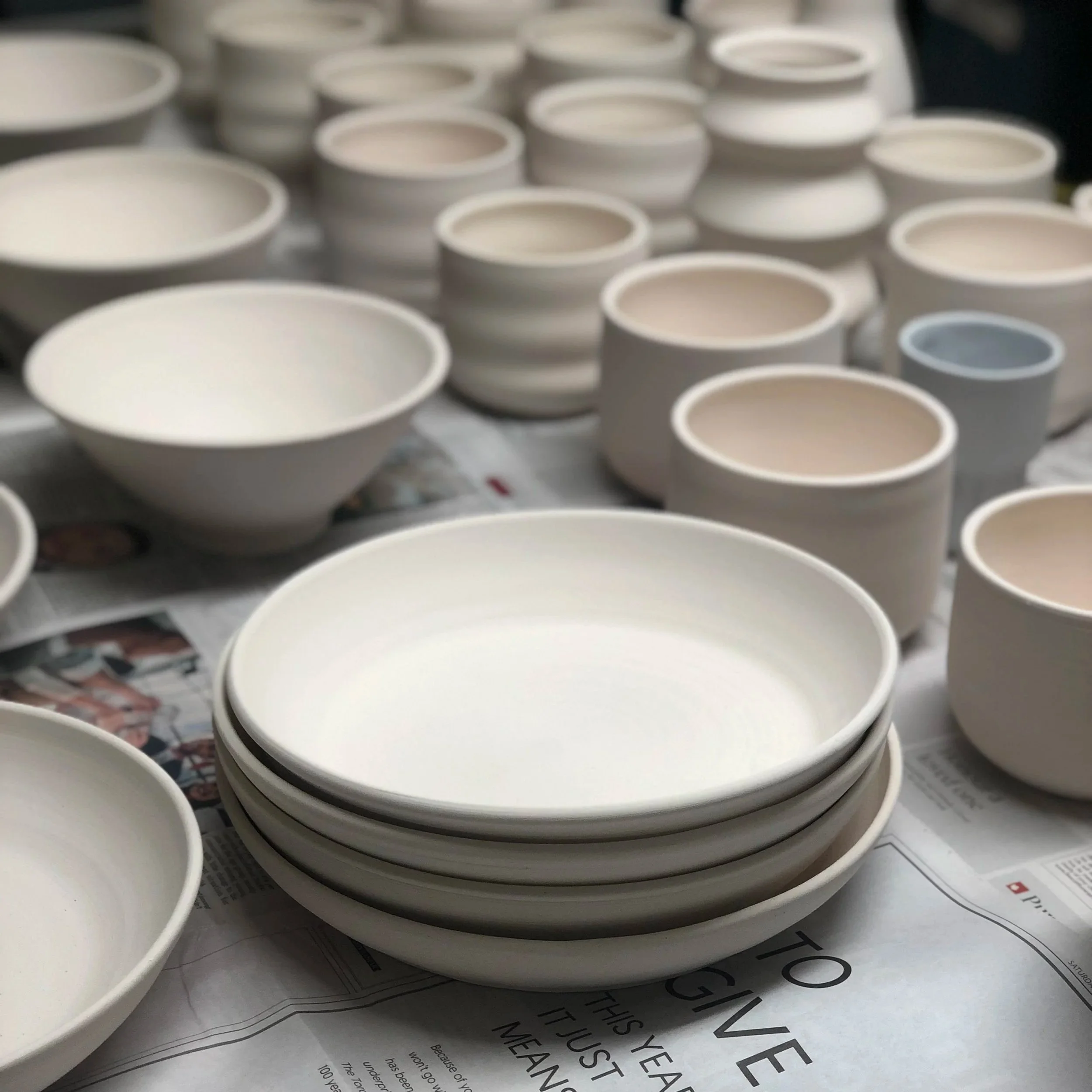 bisqued white clay waiting for glaze