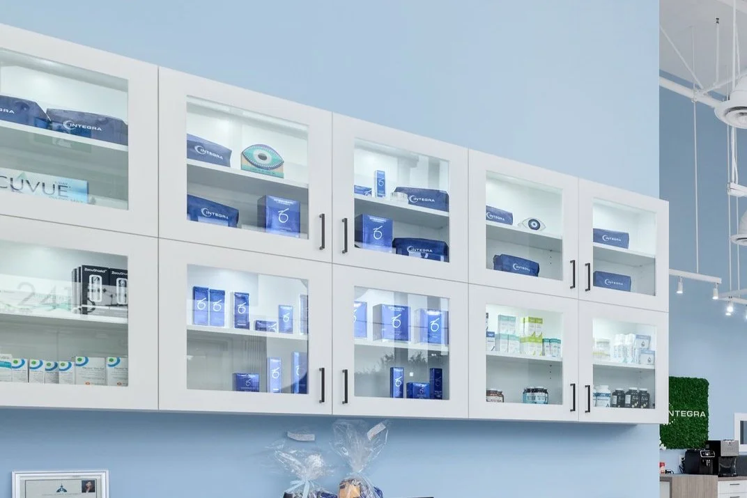 Eyewear and eye care product displays inside Integra Eyecare Centre.