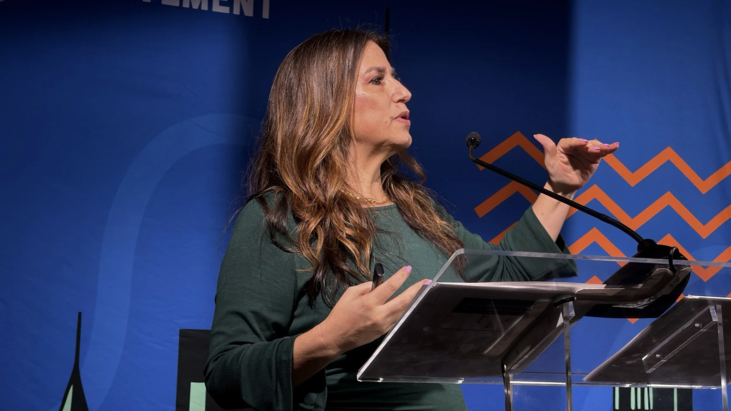 Tess speaking at Podcast Movement 2026