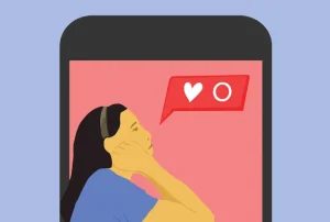A person looking at a smartphone with a social media notification showing a heart and a zero, indicating no likes.