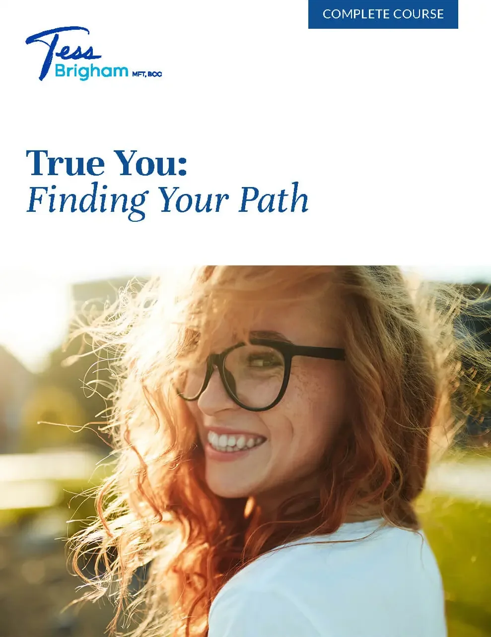 Cover of a course book titled 'True You: Finding Your Path' with a smiling woman with curly red hair and glasses outdoors in bright sunlight.