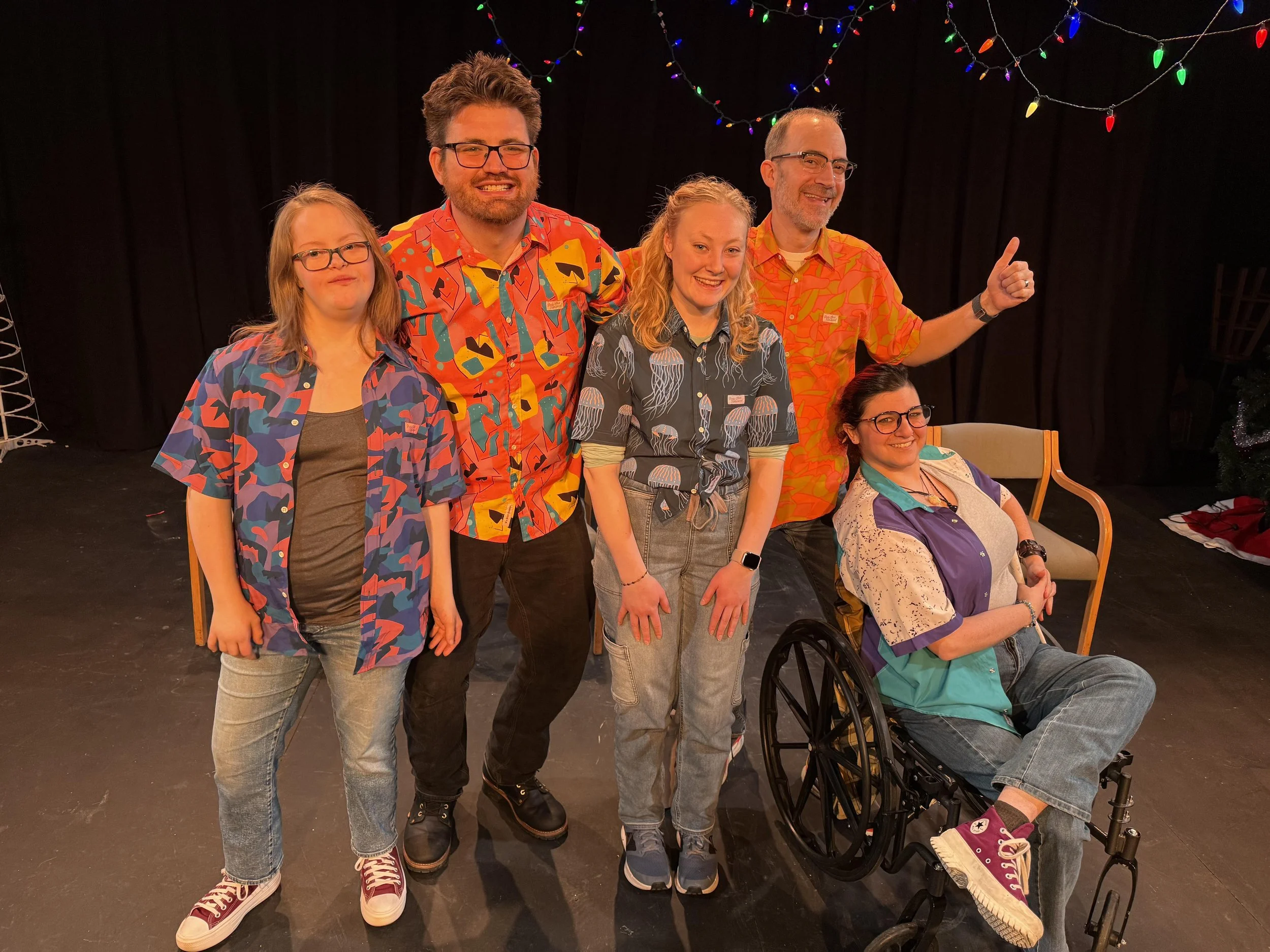 The MNprov Live improv pose for a group photo in Hawaiian shirts