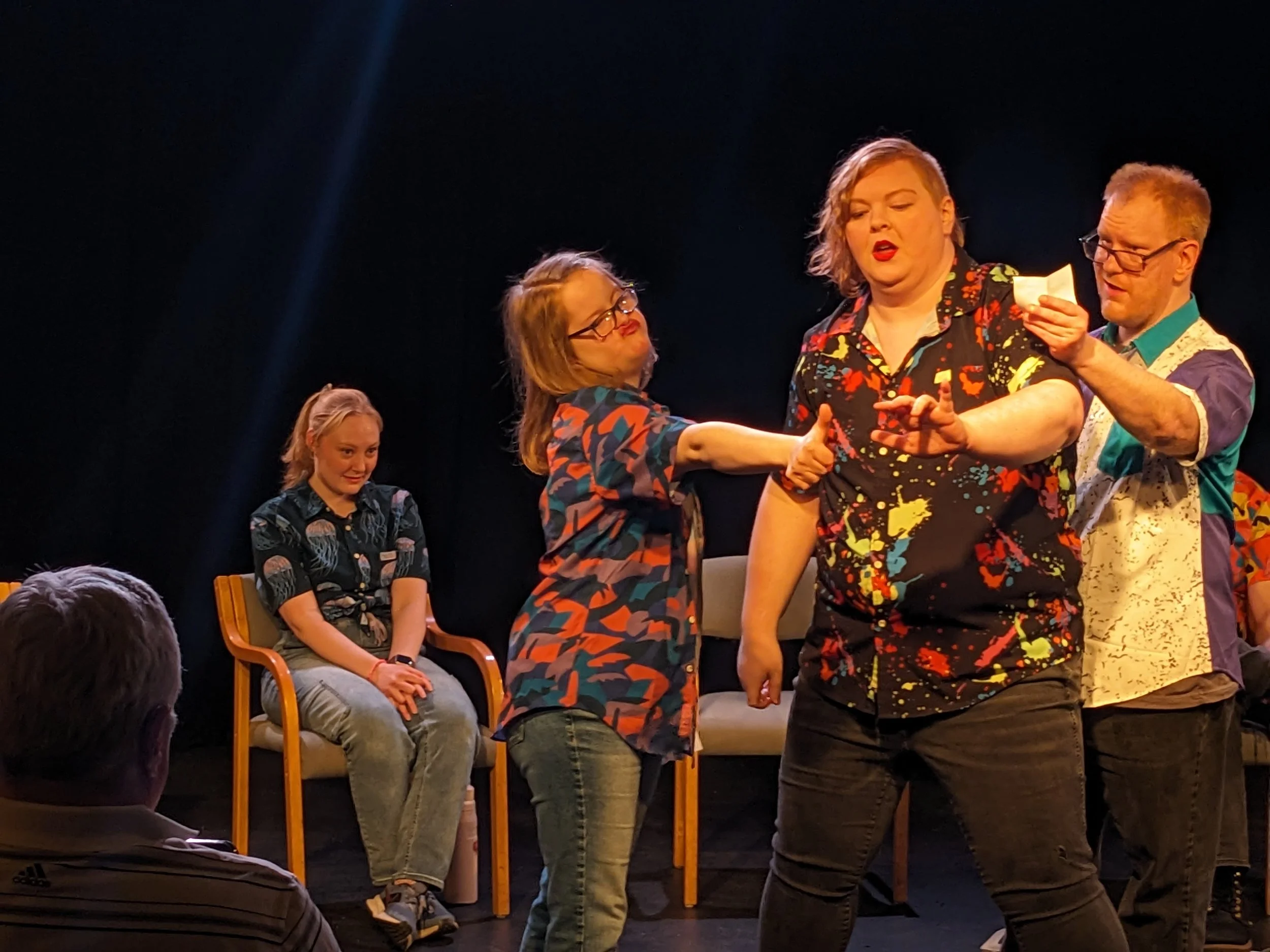 MNprov Live! cast members perform a scene