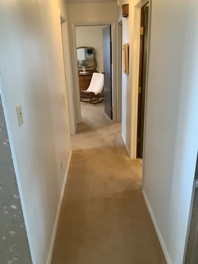 Hall to bedrooms and second bathroom